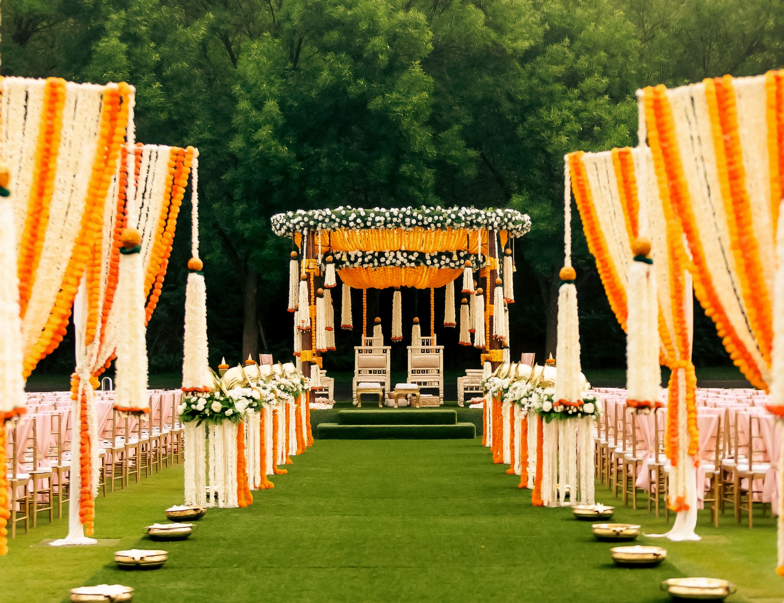 Vibrant wedding venue surrounded by colorful flowers and lush greenery